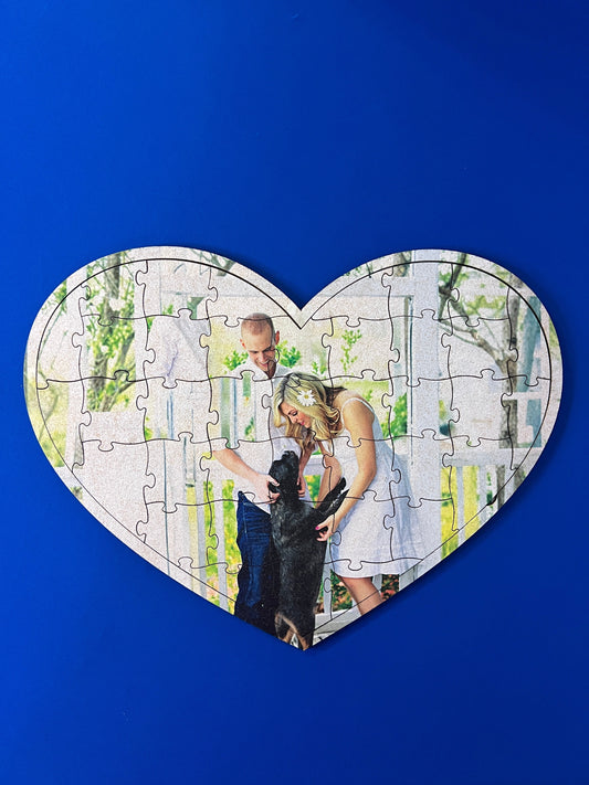Valentine heart shaped wooden puzzle with image of couple and dog