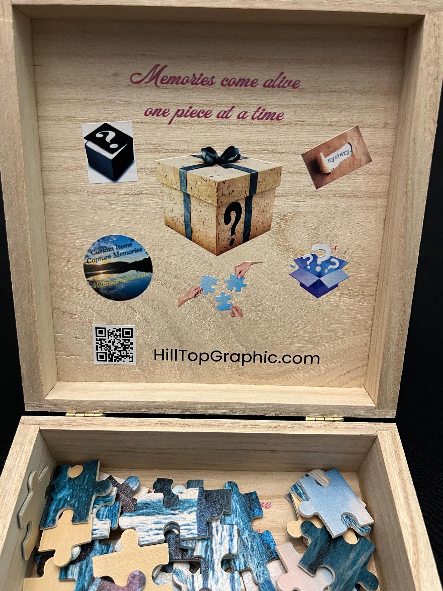 Wooden puzzle box with puzzle pieces and decorative elements, featuring HillTopGraphic.com branding.