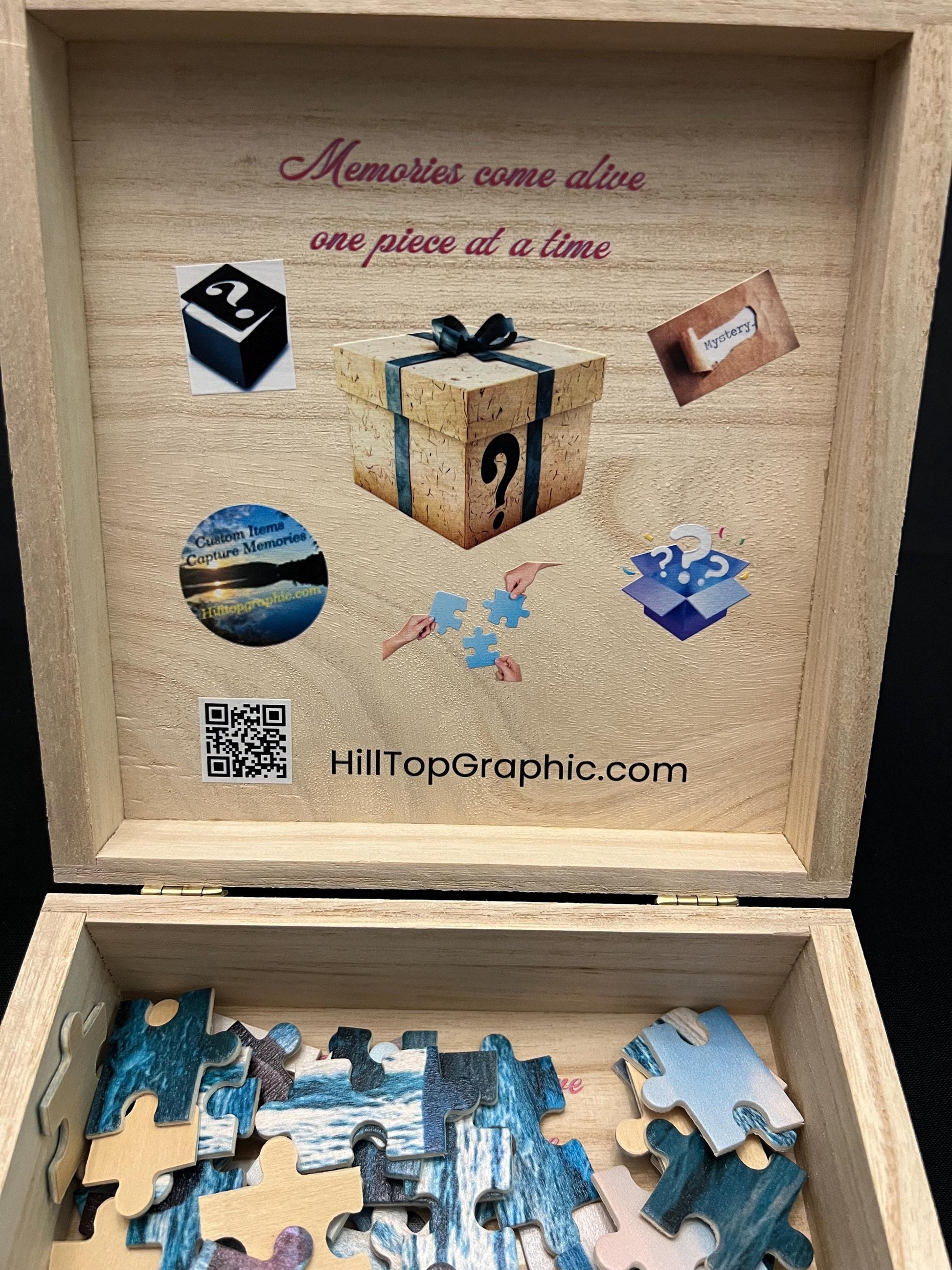 Wooden puzzle box with puzzle pieces and decorative elements, featuring HillTopGraphic.com branding.