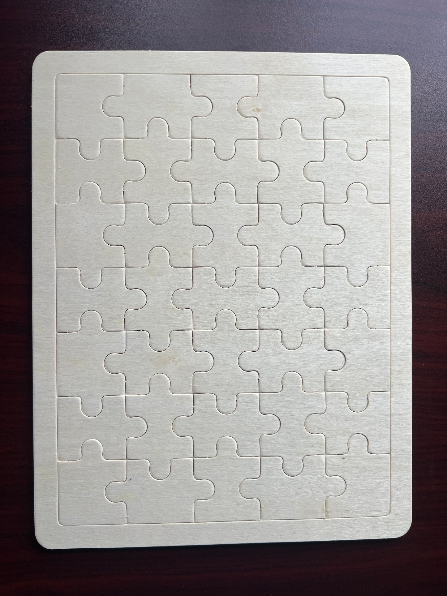 White 35 piece puzzle on a dark surface