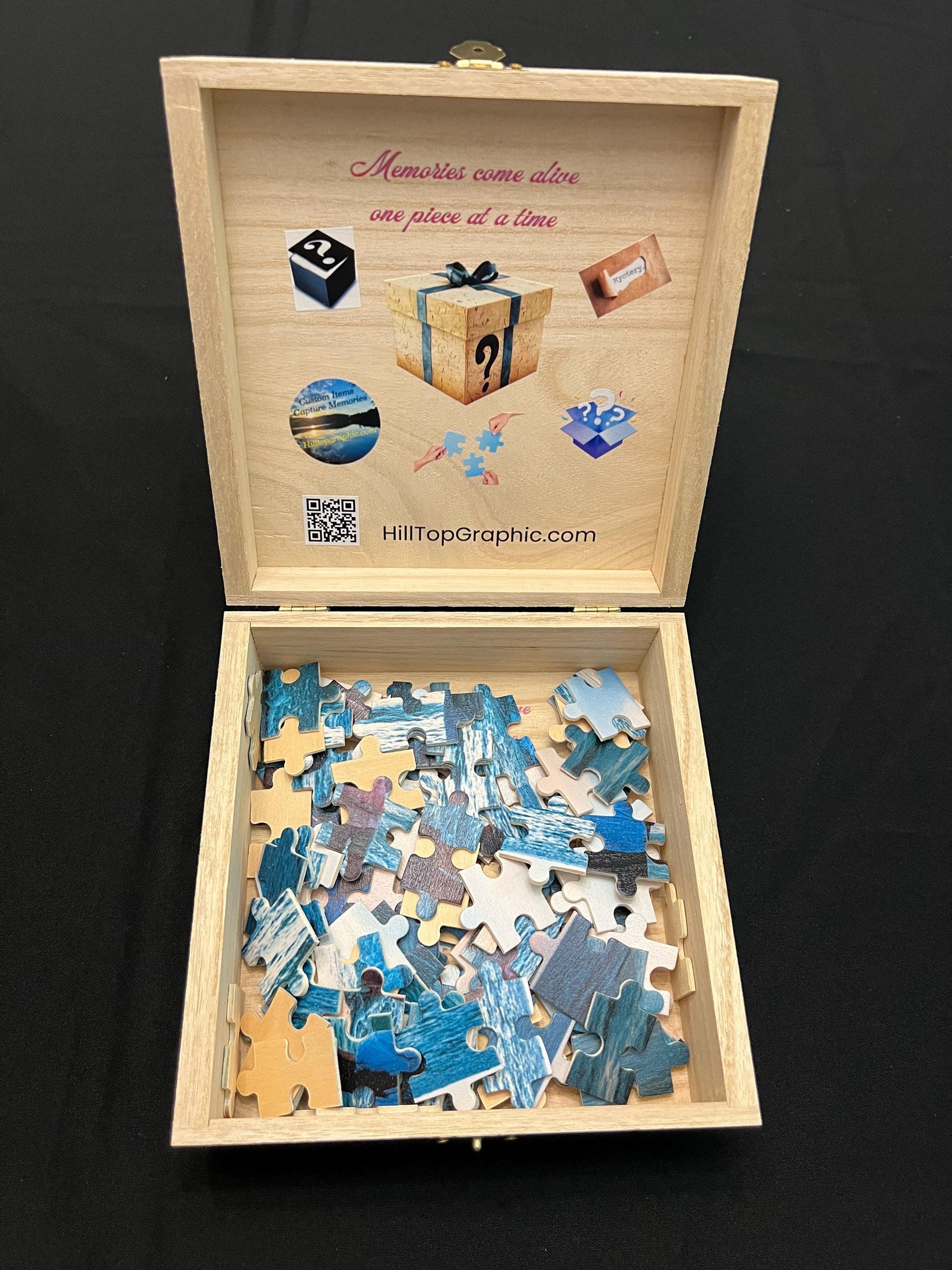 Wooden puzzle box with a partially completed puzzle inside, on a black background.