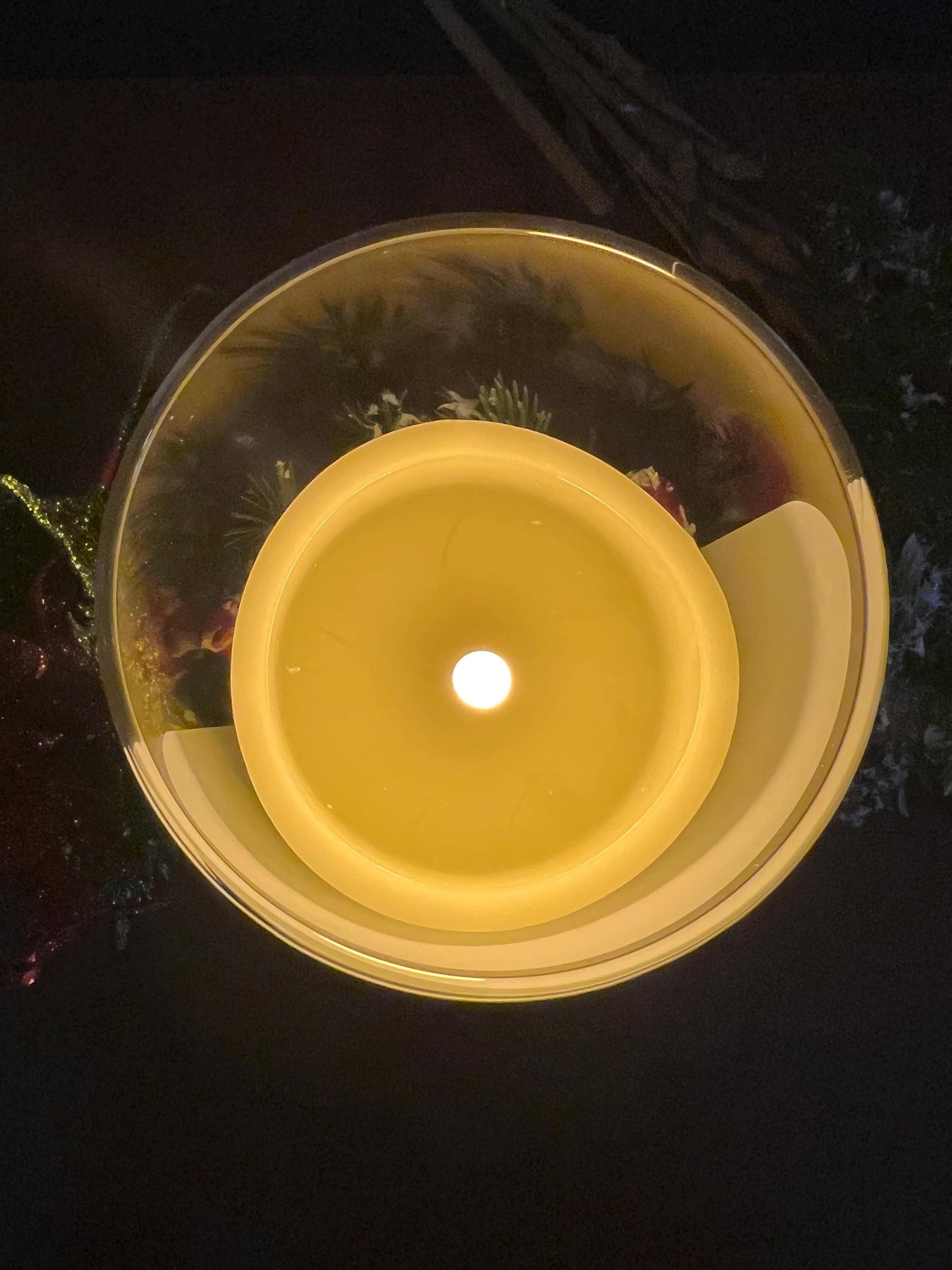 Flameless candle inside a glass candle jar. 