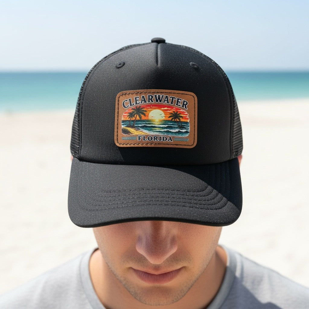 Black cap with a 'Clearwater, Florida' patch on a beach background