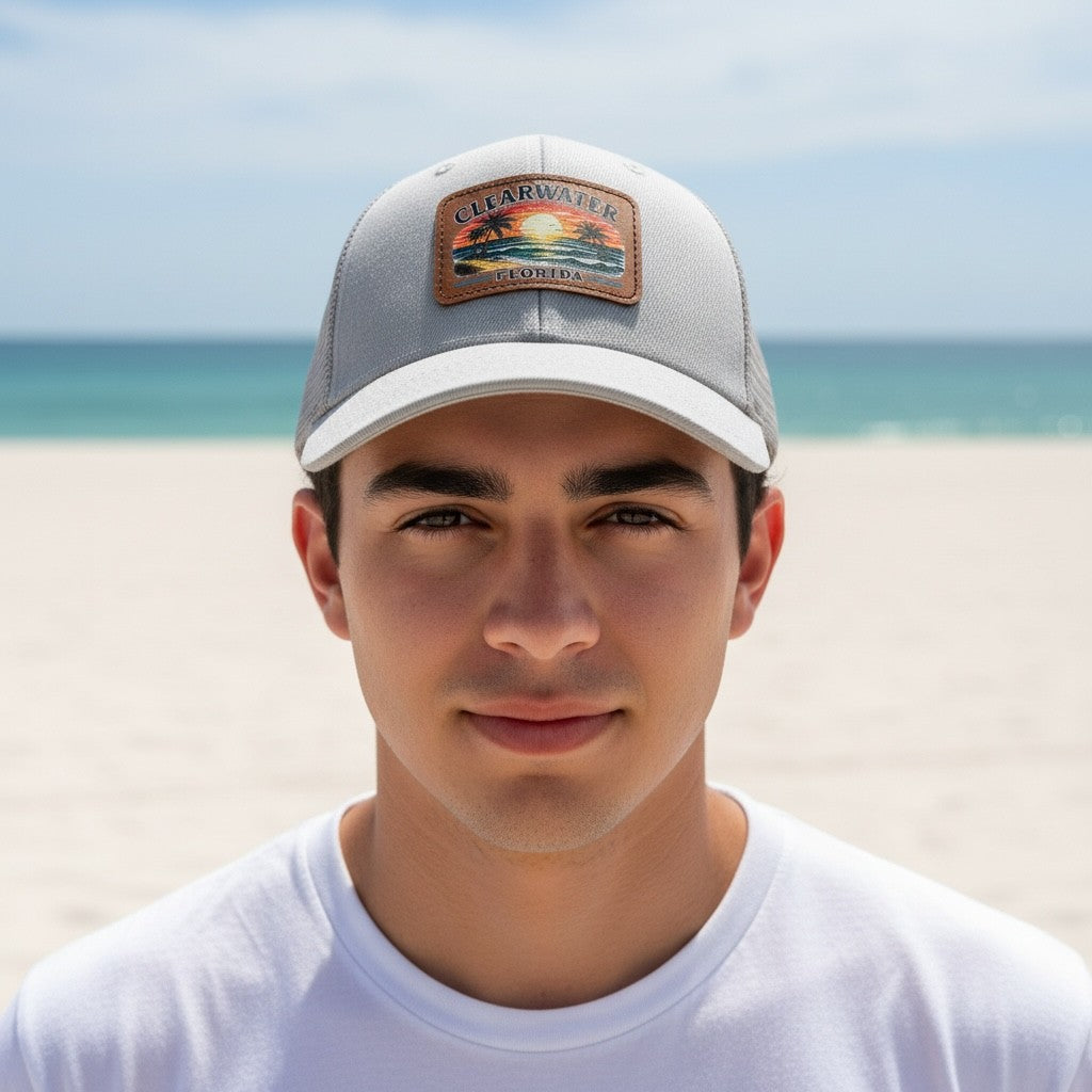 Man wearing a cap with a beach background