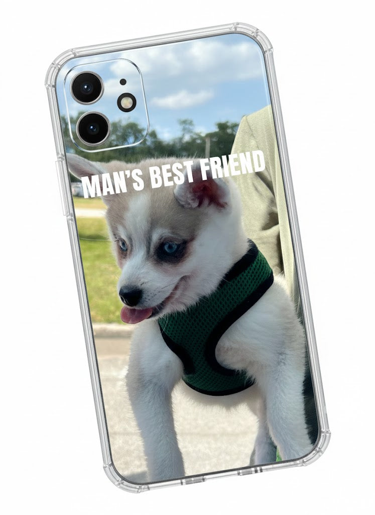 Phone case with a husky puppy and 'Man's Best Friend' text on a scenic background